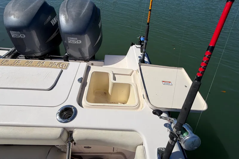 Slide: The Image of 2006 Grady-White Sailfish 282 boat with Yamaha 250 engines and fishing rods. - 77