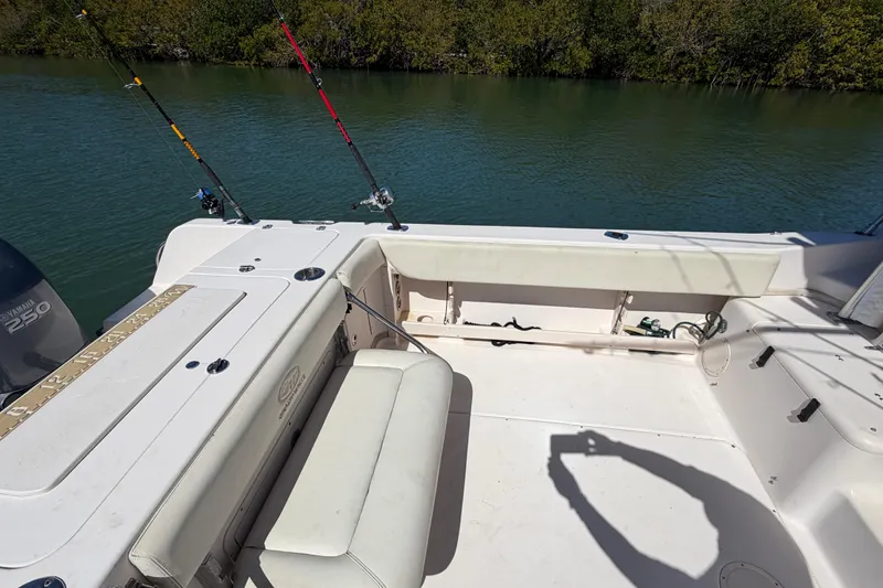 Slide: The Image of 2006 Grady-White Sailfish 282 boat interior with fishing rods and Yamaha 250 engine. - 79