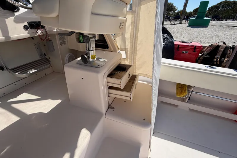 Slide: The Image of 2006 Grady-White Sailfish 282 boat interior with open storage compartment. - 88
