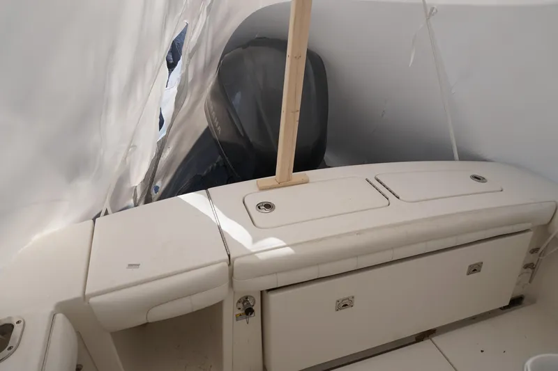 Slide: The Image of 2018 Regulator 23 boat interior with covered engine and storage compartments. - 14