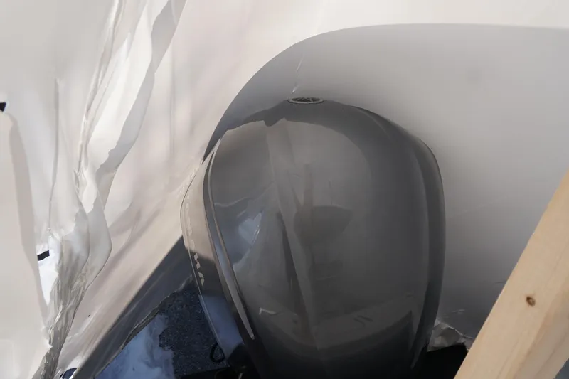 Slide: The Image of 2018 Regulator 23 boat engine covered in protective wrap. - 18