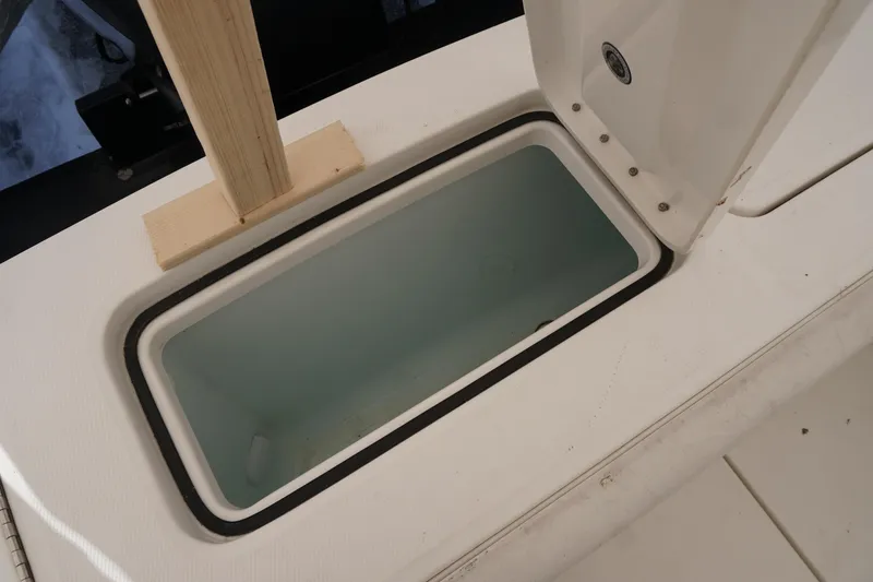 Slide: The Image of Open storage compartment on 2018 Regulator 23 boat deck. - 20