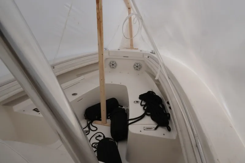 Slide: The Image of 2018 Regulator 23 boat interior with ropes and storage compartments. - 6