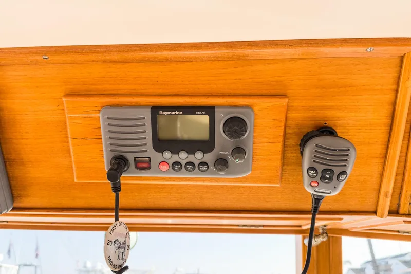Slide: The Image of VHF radio system on 1984 Grand Banks 42 Classic yacht, mounted on wooden panel. - 28