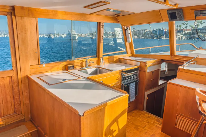 Slide: The Image of Interior of 1984 Grand Banks 42 Classic yacht with wooden cabinetry and ocean view. - 31