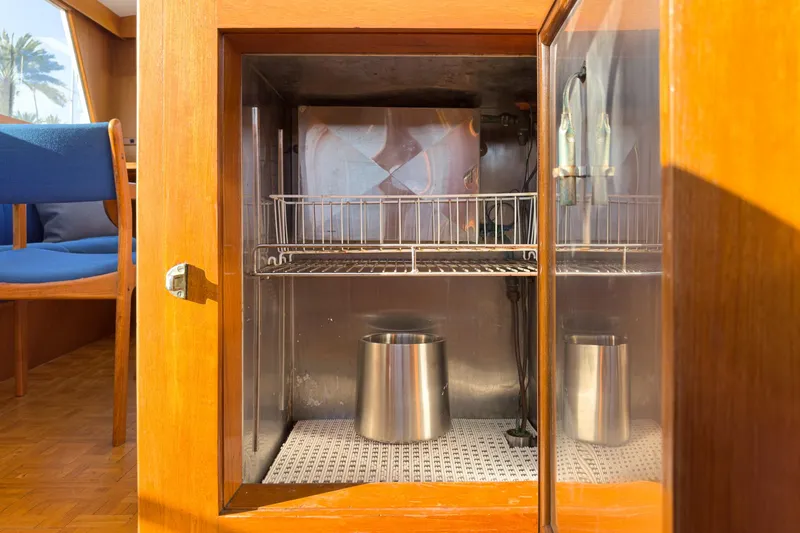 Slide: The Image of Wooden cabinet with metal interior on a 1984 Grand Banks 42 Classic yacht. - 33