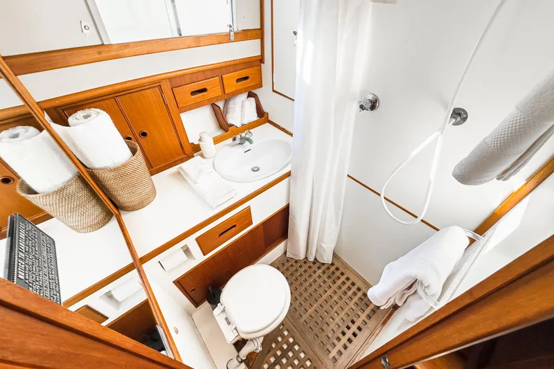 Slide: The Image of 1984 Grand Banks 42 Classic yacht bathroom with wooden accents and modern amenities. - 47