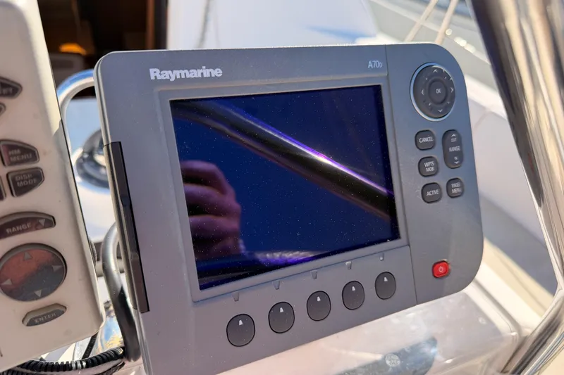Slide: The Image of Raymarine A70 display on 1996 Hunter 336 sailboat, showing navigation controls. - 10
