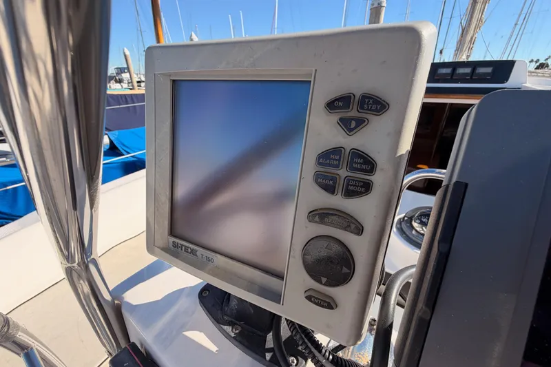 Slide: The Image of Navigation system on a 1996 Hunter 336 sailboat, featuring a Sitex T-150 display. - 11