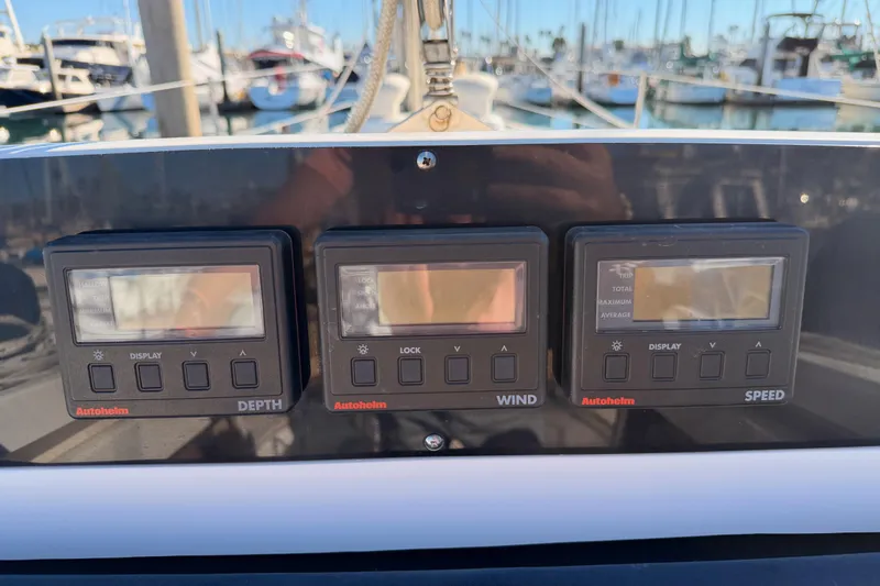 Slide: The Image of Autopilot control panel on a 1996 Hunter 336 sailboat, displaying depth, wind, and speed. - 14