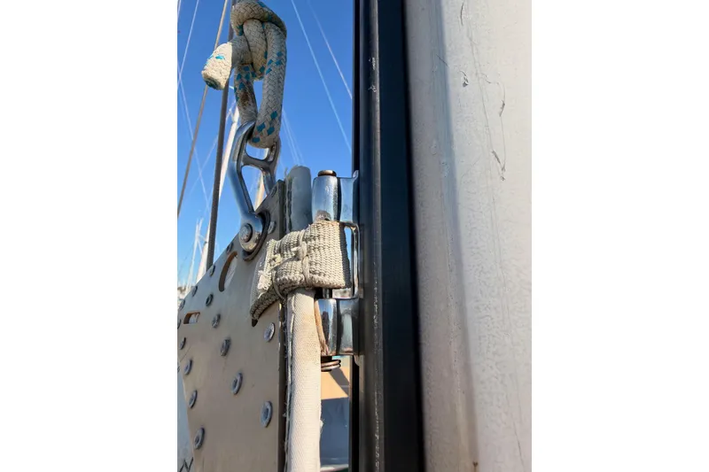 Slide: The Image of Close-up of rigging on a 1996 Hunter 336 sailboat against a clear blue sky. - 19