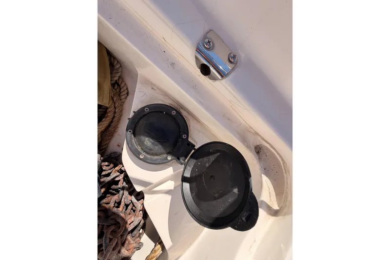 Slide: The Image of Deck of 1996 Hunter 336 sailboat with open hatch and coiled rope. - 22