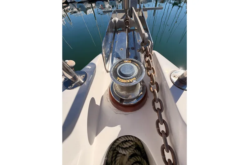 Slide: The Image of Anchor windlass and chain on 1996 Hunter 336 sailboat deck. - 23