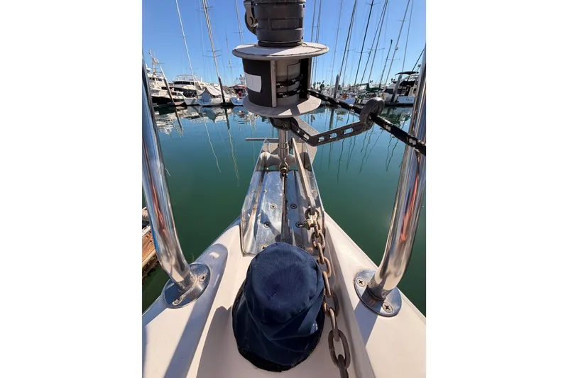 Slide: The Image of Bow of 1996 Hunter 336 sailboat with anchor chain in marina. - 24