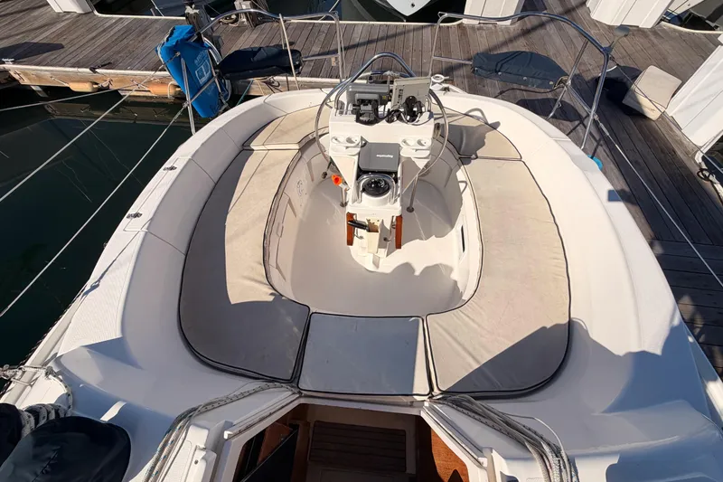 Slide: The Image of Cockpit of a 1996 Hunter 336 sailboat with seating and steering wheel. - 28