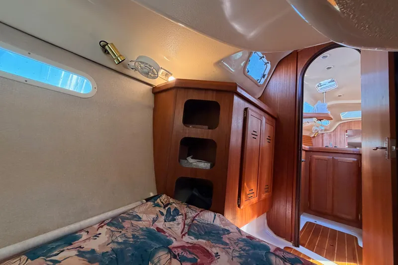 Slide: The Image of Interior of 1996 Hunter 336 sailboat with cozy cabin and wooden furnishings. - 37