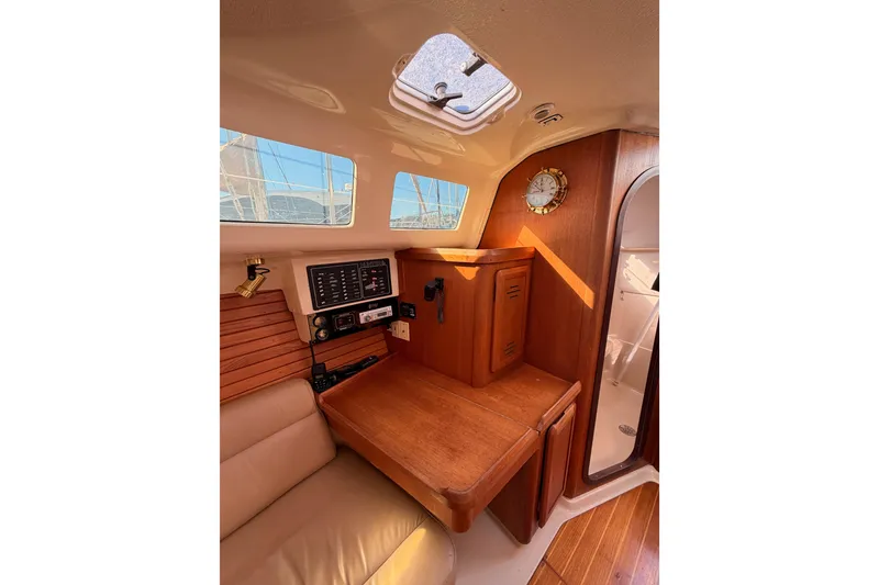 Slide: The Image of Interior of 1996 Hunter 336 sailboat with navigation station and wooden cabinetry. - 46