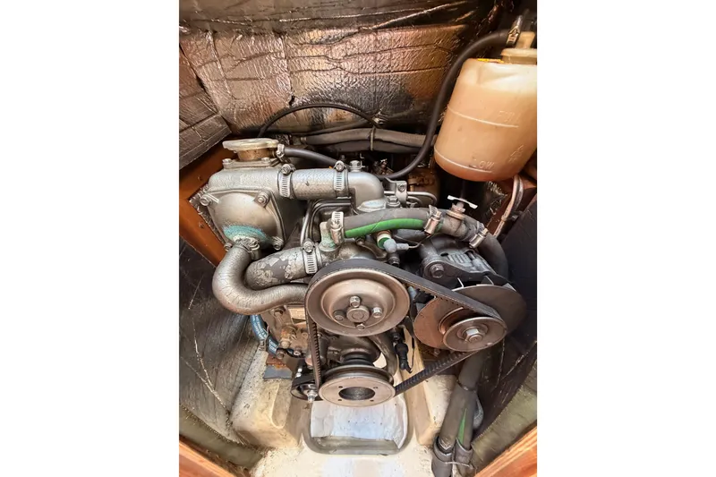 Slide: The Image of Engine compartment of a 1996 Hunter 336 sailboat, showing belts and hoses. - 58