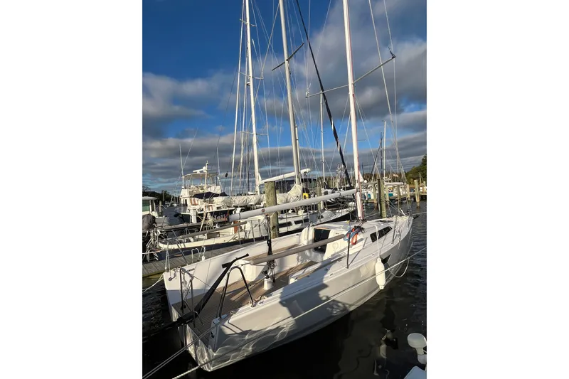 Slide: The Image of 2025 Zonda Yachts Z28 sailboat docked at marina under blue sky. - 14