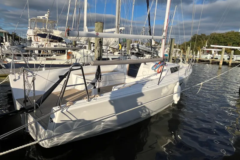 Slide: The Image of 2025 Zonda Yachts Z28 docked at marina, sleek design, sunny day, calm waters. - 15