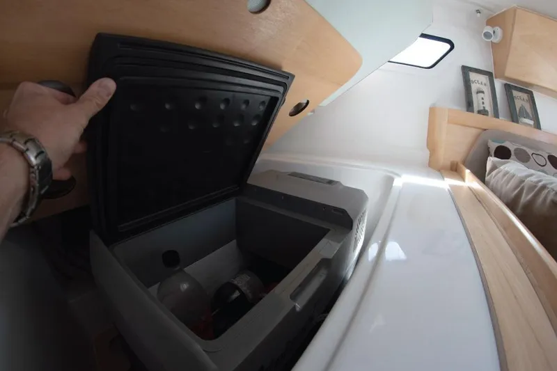 Slide: The Image of Interior view of 2025 Zonda Yachts Z28, featuring a compact storage compartment. - 4