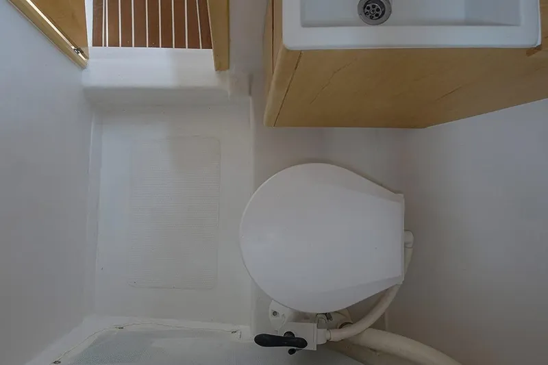 Slide: The Image of Compact bathroom in 2025 Zonda Yachts Z28, featuring a toilet and sink. - 6