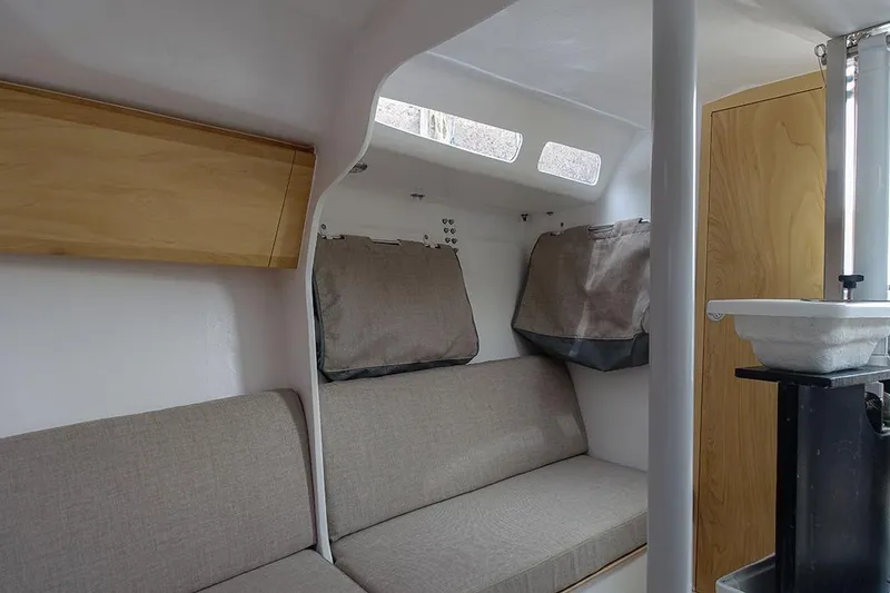 Slide: The Image of Interior of 2025 Zonda Yachts Z28, featuring cozy seating and modern design elements. - 9