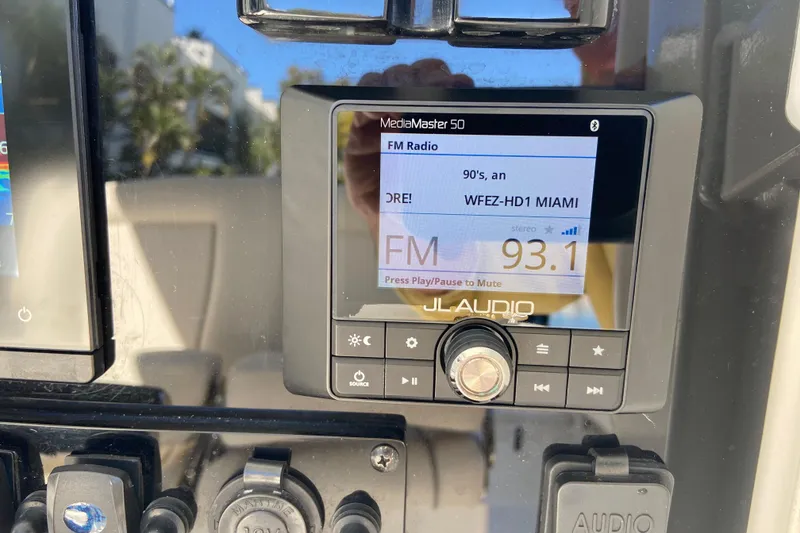Slide: The Image of JL Audio MediaMaster 50 displaying FM radio station 93.1 on Sea Hunt Gamefish 27 boat. - 14