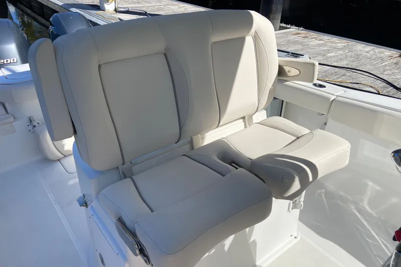 Slide: The Image of 2023 Sea Hunt Gamefish 27 Forward Seating with comfortable beige upholstery. - 18