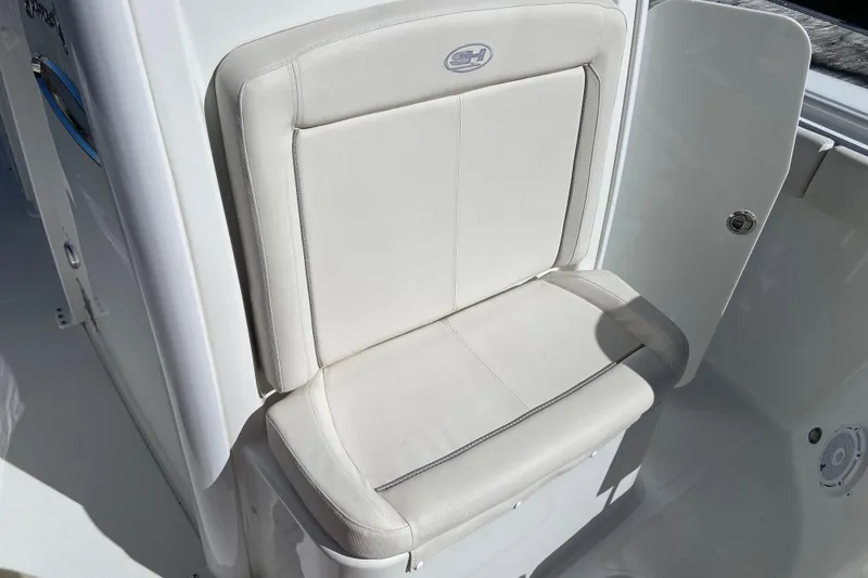 Slide: The Image of 2023 Sea Hunt Gamefish 27 Forward Seating, white cushioned seat detail. - 19