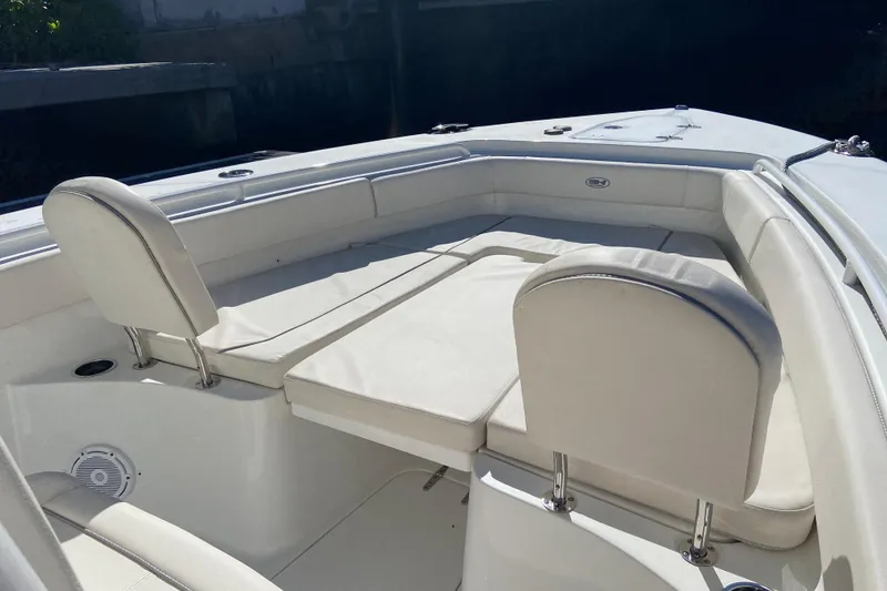 Slide: The Image of 2023 Sea Hunt Gamefish 27 Forward Seating with white cushioned seats. - 20