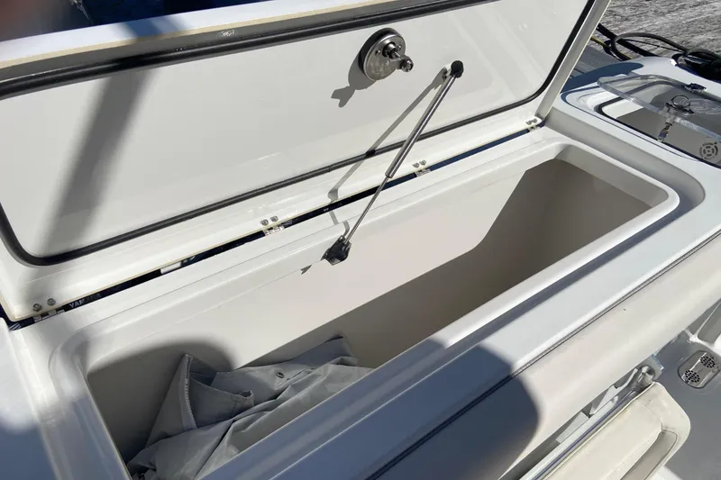 Slide: The Image of 2023 Sea Hunt Gamefish 27 Forward Seating storage compartment open. - 22