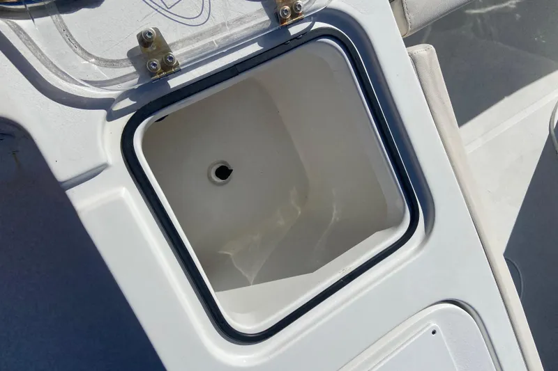 Slide: The Image of Open storage compartment on 2023 Sea Hunt Gamefish 27 Forward Seating boat. - 25
