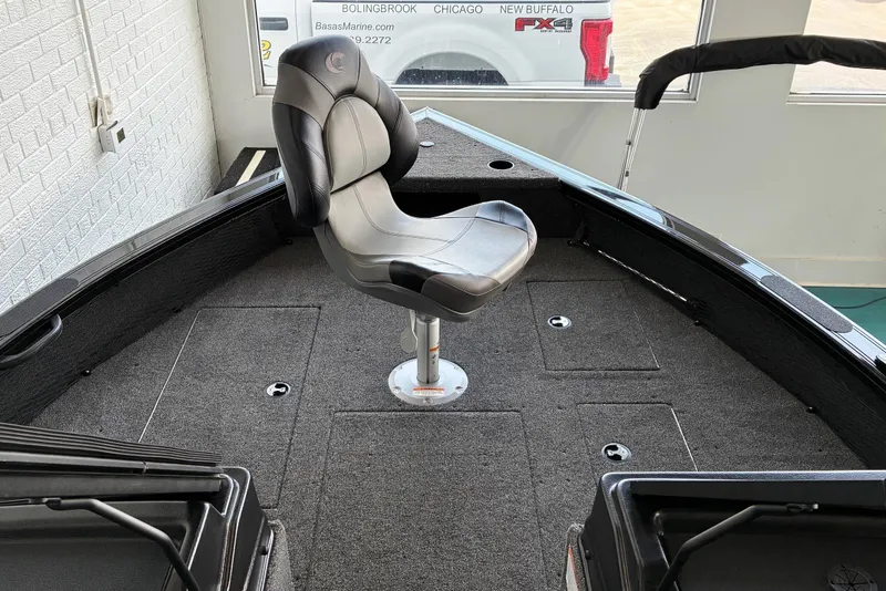 Slide: The Image of 2026 Crestliner 2050 Fish Hawk boat interior with swivel seat and carpeted deck. - 7