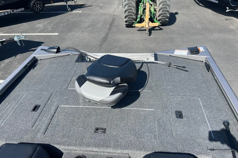 Slide: The Image of 2026 Crestliner XF 189 boat deck with seating and storage compartments. - 11