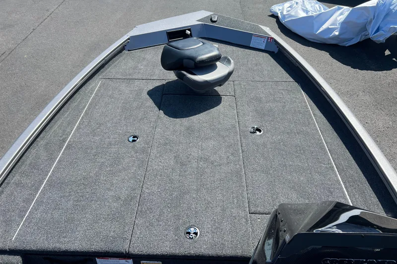 Slide: The Image of 2026 Crestliner XF 189 boat deck with seating, featuring a sleek, carpeted design. - 2