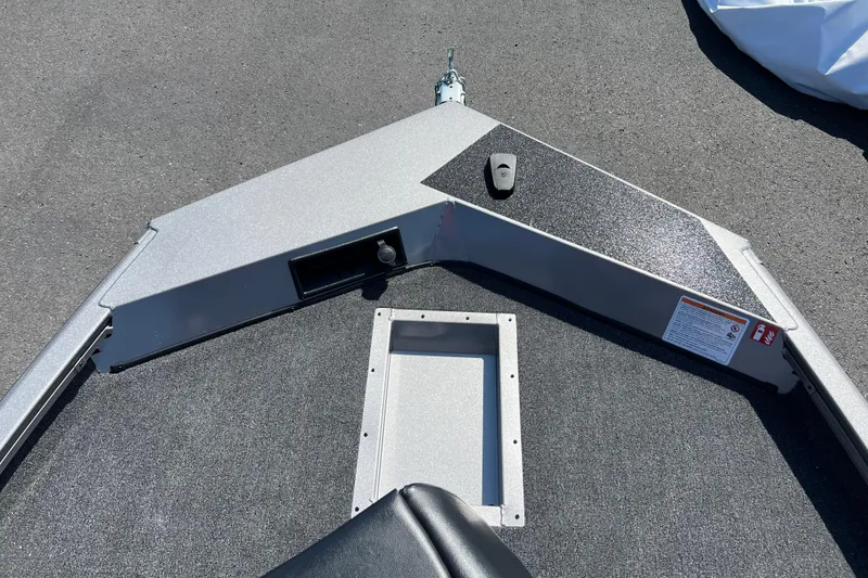 Slide: The Image of 2026 Crestliner XF 189 boat deck with storage compartment and control panel. - 3