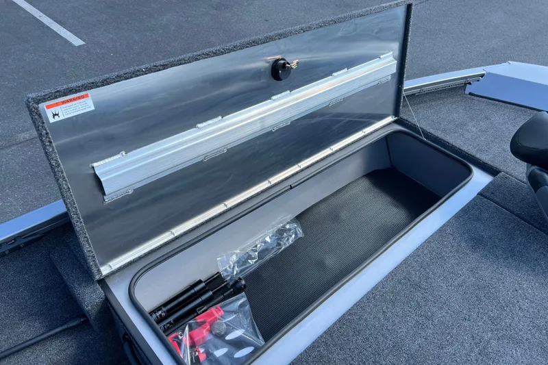 Slide: The Image of Open storage compartment in 2026 Crestliner XF 189 boat, showcasing interior space and accessories. - 5