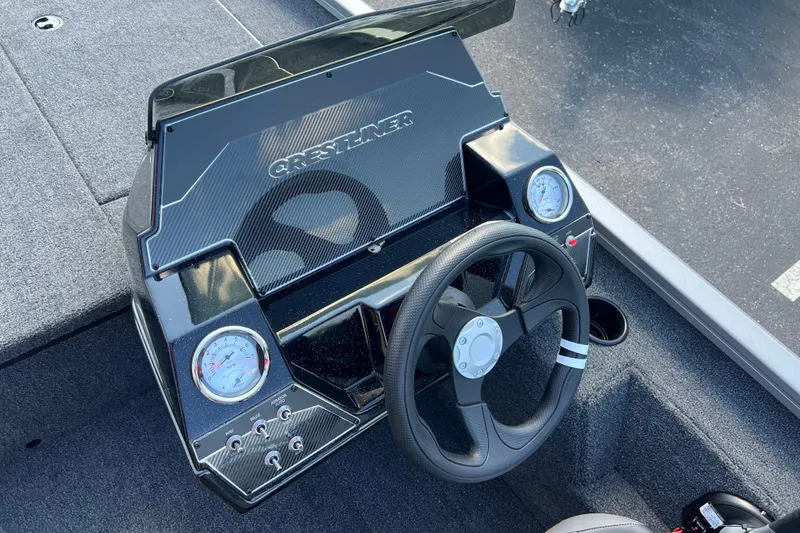 Slide: The Image of 2026 Crestliner XF 189 boat dashboard with steering wheel and gauges. - 9