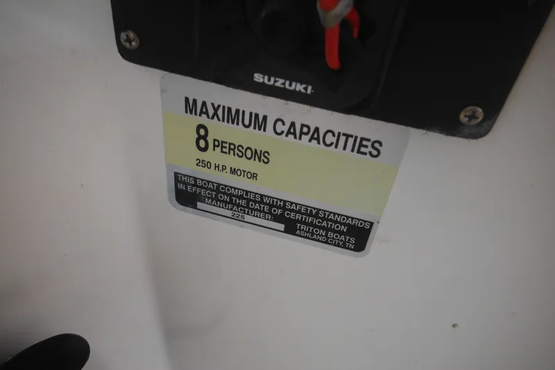 Slide: The Image of 2006 Triton 225 DC capacity label: 8 persons, 250 HP motor compliance. - 48