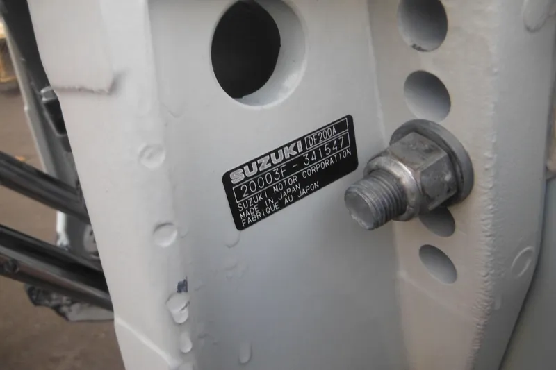 Slide: The Image of Close-up of a Suzuki DF200A engine label on a 2006 Triton 225 DC boat. - 5