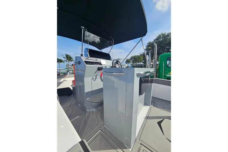 Slide: The Image of 2026 Murano Yachts Rovercat 205 cockpit with modern controls and sleek design. - 12