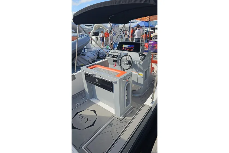 Slide: The Image of 2026 Murano Yachts Rovercat 205 interior with modern helm and seating. - 6