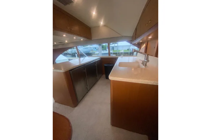 Slide: The Image of Interior of 2002 Ocean Yacht Super Sport with modern kitchen and sleek design. - 6