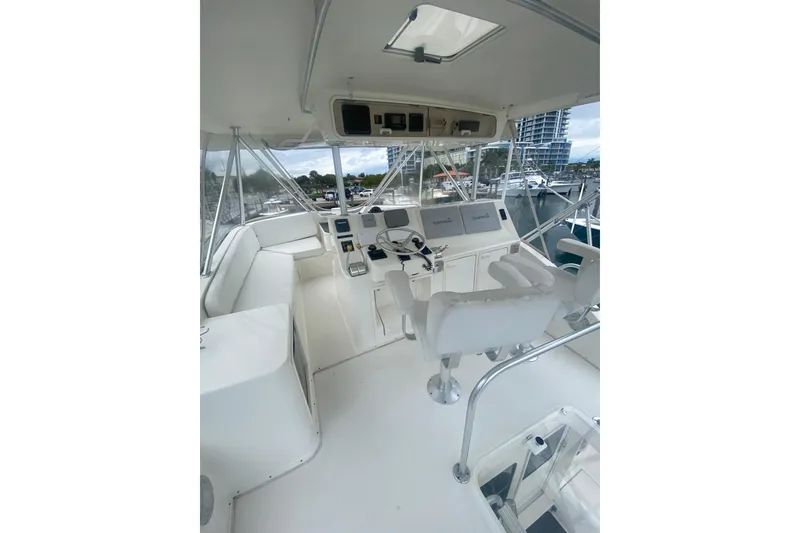 Slide: The Image of 2002 Ocean Yacht Super Sport cockpit with modern navigation equipment and comfortable seating. - 10