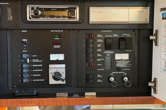 Slide: The Image of Electrical control panel of a 2003 Sea Ray 290 Amberjack boat. - 18