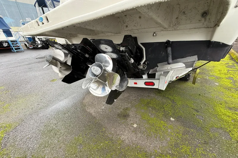 Slide: The Image of Rear view of 2004 Sea Ray 290 Amberjack boat with dual propellers. - 24