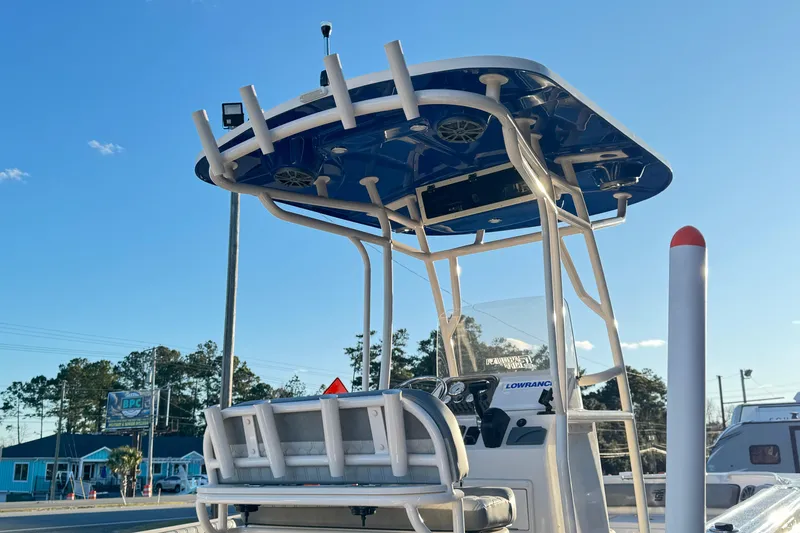 Slide: The Image of 2026 Carolina Skiff 21 Ultra Elite boat with T-top and fishing rod holders. - 11