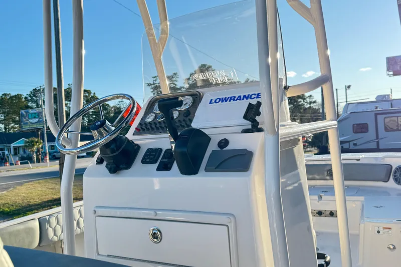 Slide: The Image of 2026 Carolina Skiff 21 Ultra Elite boat console with steering wheel and Lowrance equipment. - 5