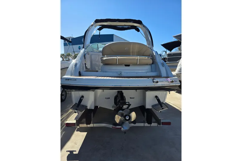 Slide: The Image of 2022 Crownline 264 CR boat, rear view, showcasing sleek design and propeller. - 4
